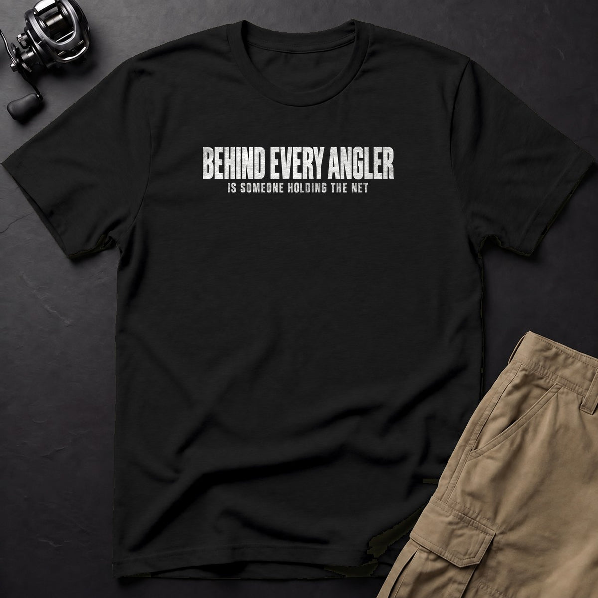 Behind Every Angler Is Someone Holding the Net T-Shirt — Black