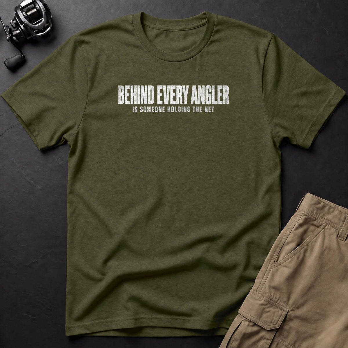 Behind Every Angler Is Someone Holding the Net T-Shirt — Sage